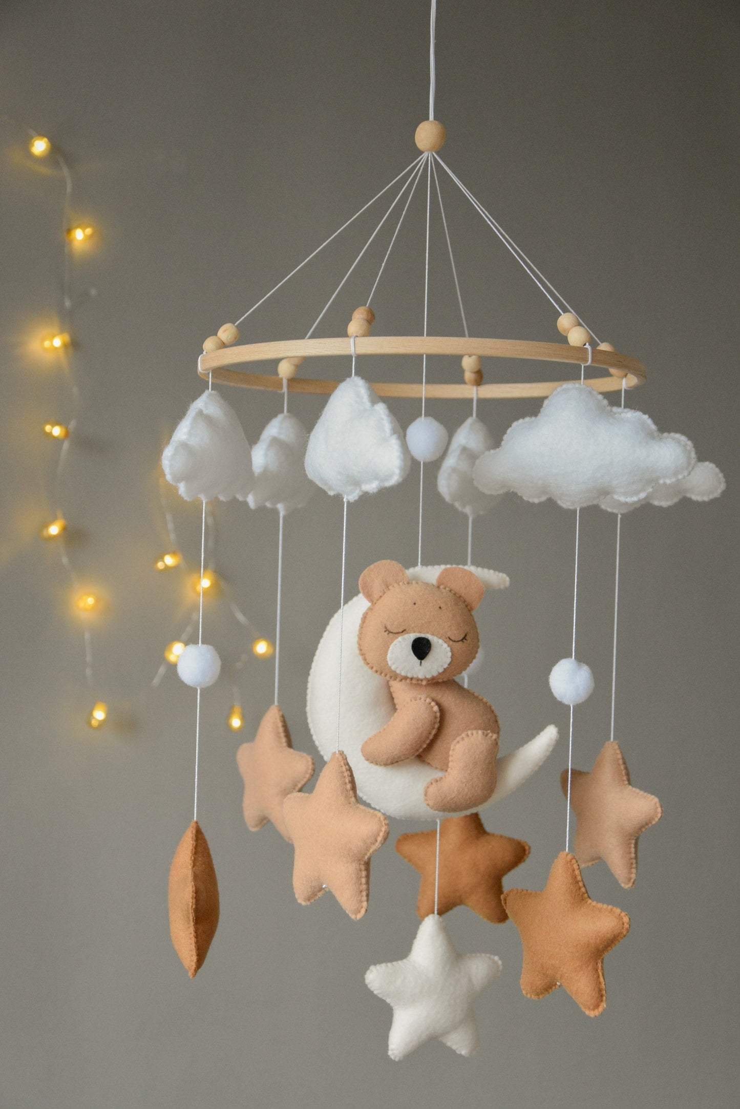 Baby mobile with sleeping bear, moon, stars and clouds