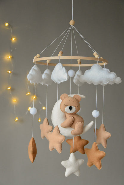 Baby mobile with sleeping bear, moon, stars and clouds