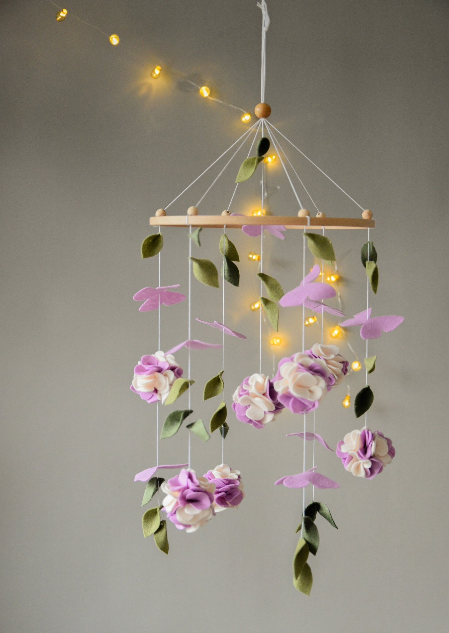 Floral mobile with purple white flower, butterfly and leaves