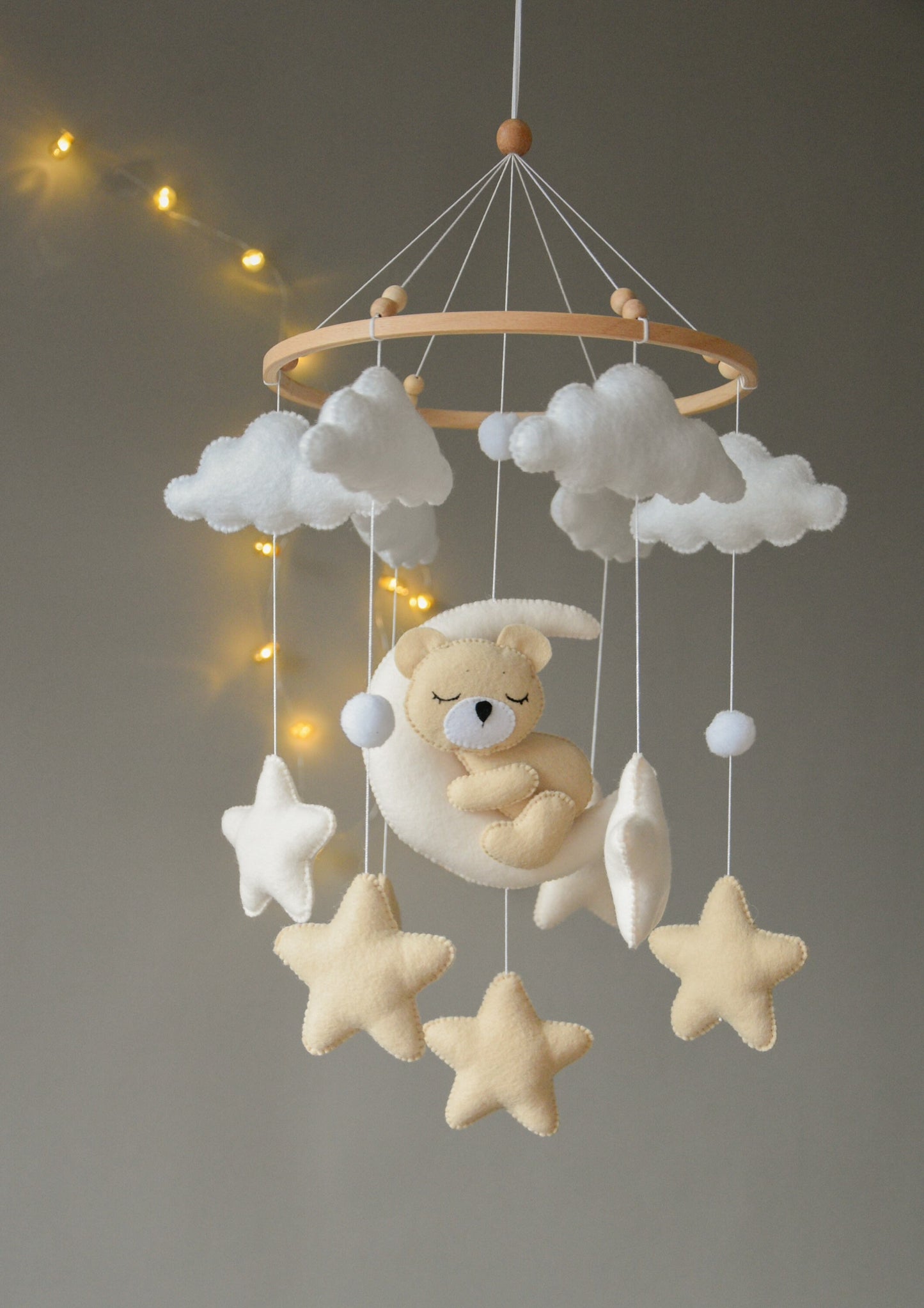 Sleeping bear mobile with beige and soft white stars, clouds and moon