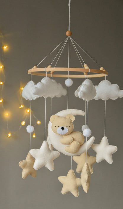 Sleeping bear mobile with beige and soft white stars, clouds and moon