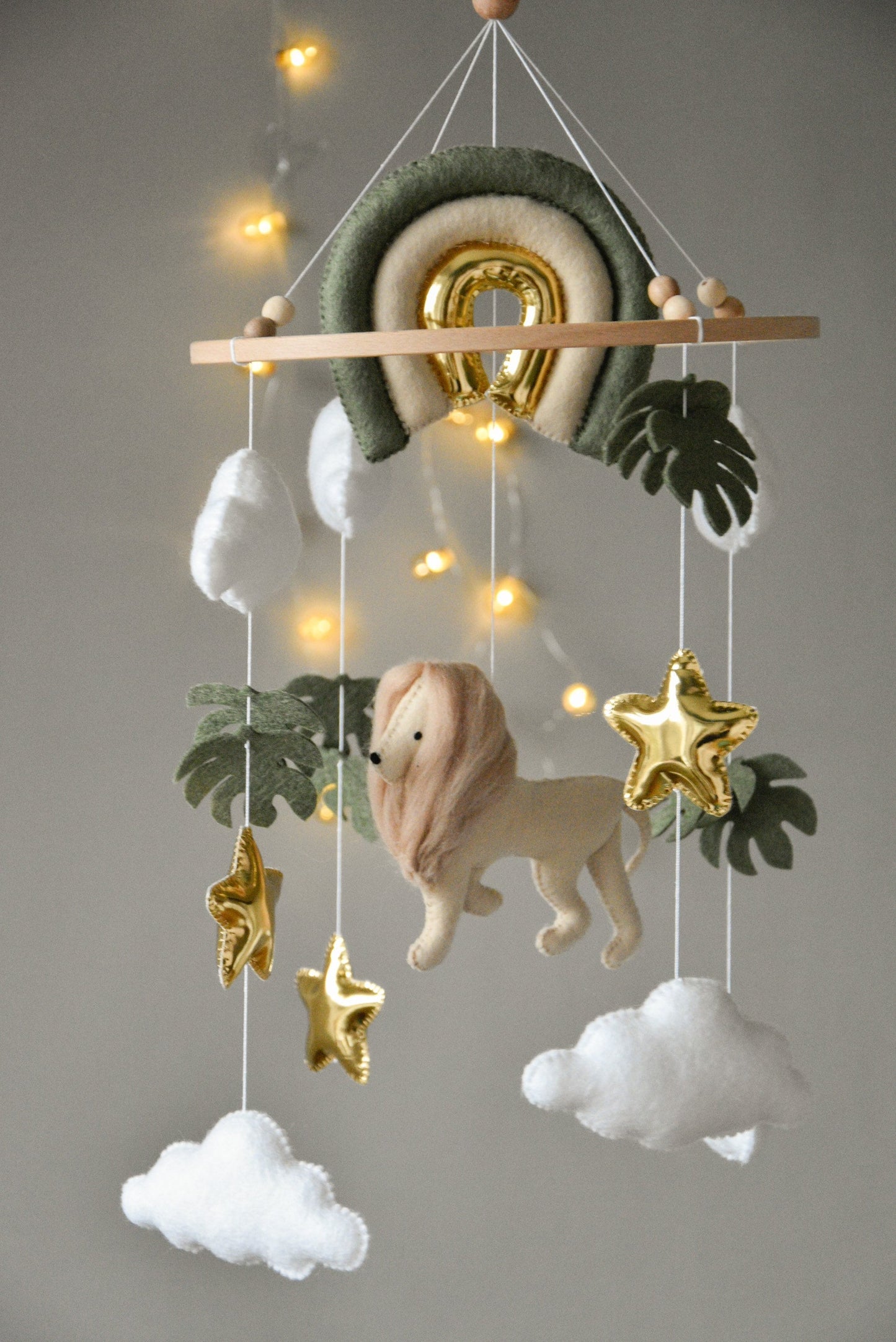 Baby mobile with Lion, golden stars clouds, monstera leaves and rainbow