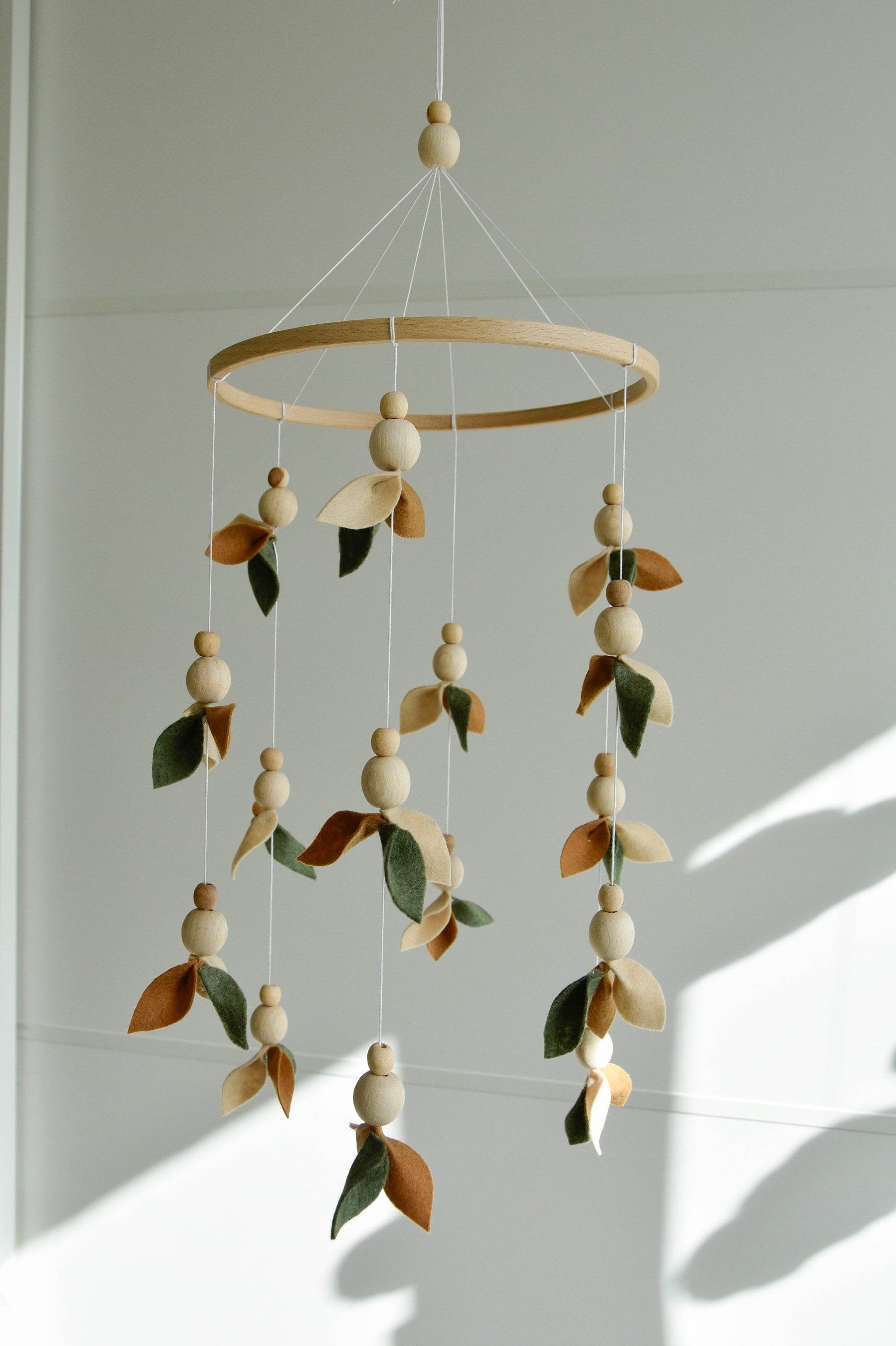 Floral mobile with wooden pearls, green, beige, brown and leaves - Minidreams Decor