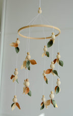 Floral mobile with wooden pearls, green, beige, brown and leaves - Minidreams Decor