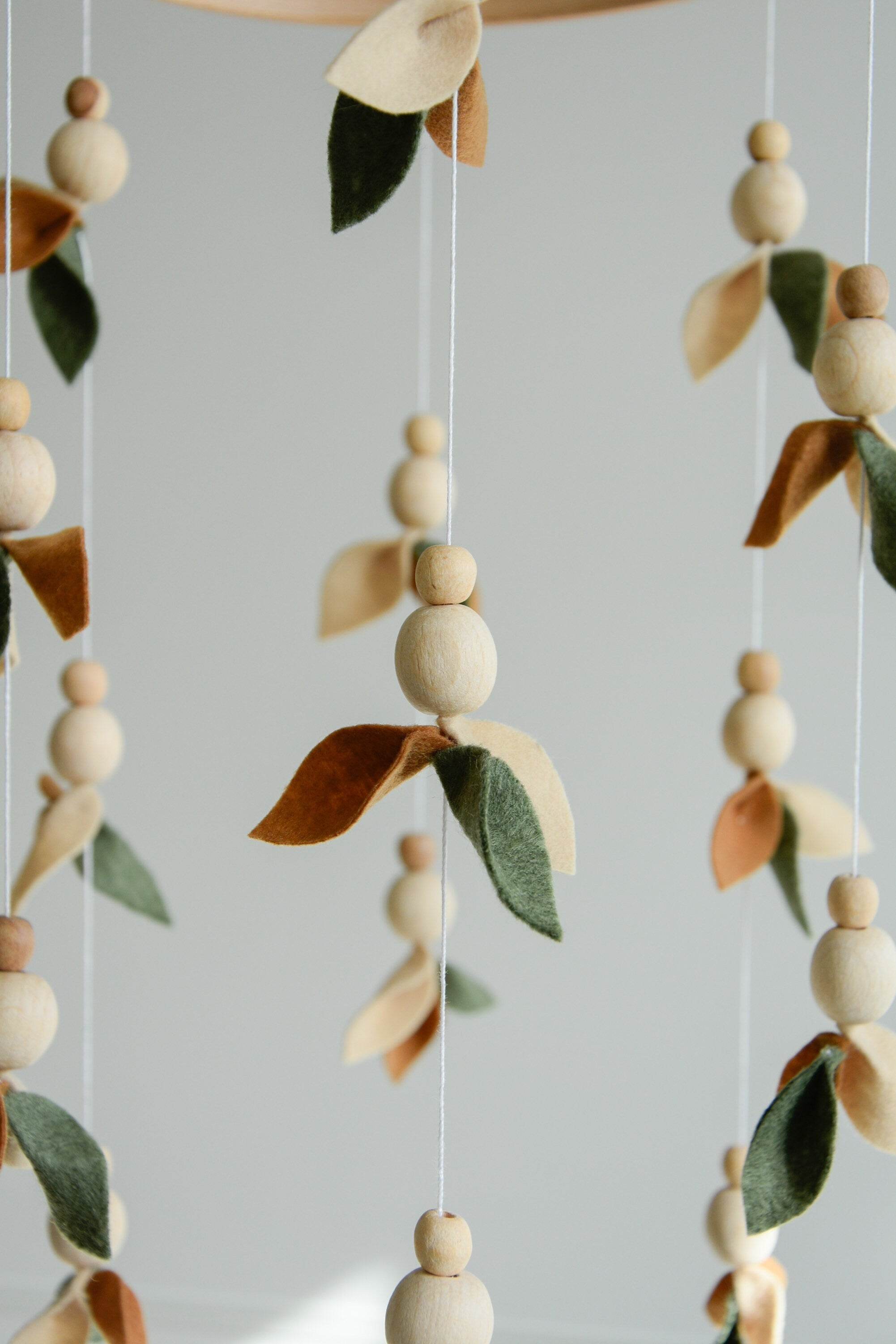Floral mobile with wooden pearls, green, beige, brown and leaves - Minidreams Decor