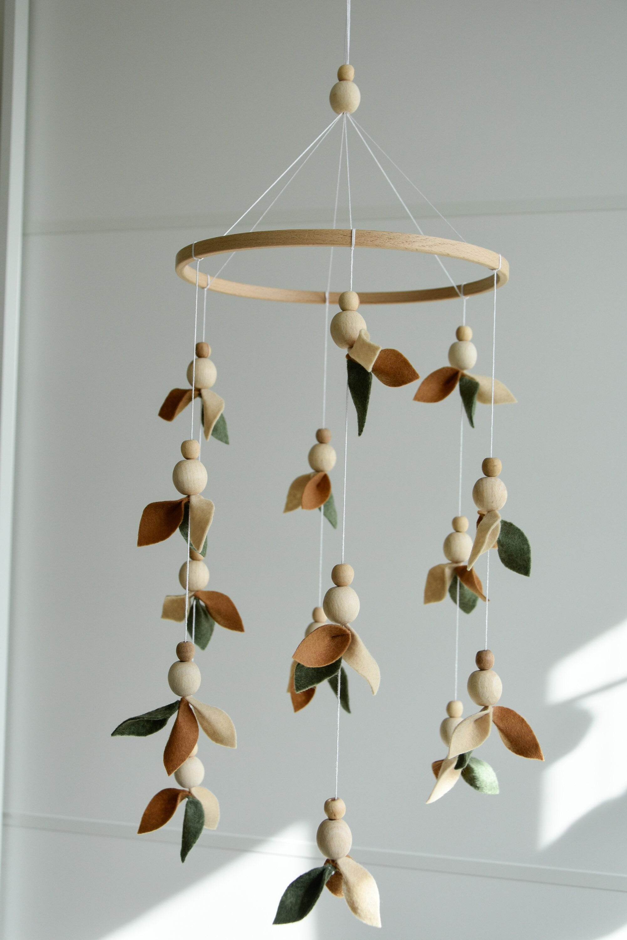 Floral mobile with wooden pearls, green, beige, brown and leaves - Minidreams Decor
