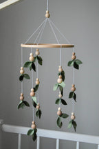 Forest style floral mobile with leaves and wooden pearls - Minidreams Decor