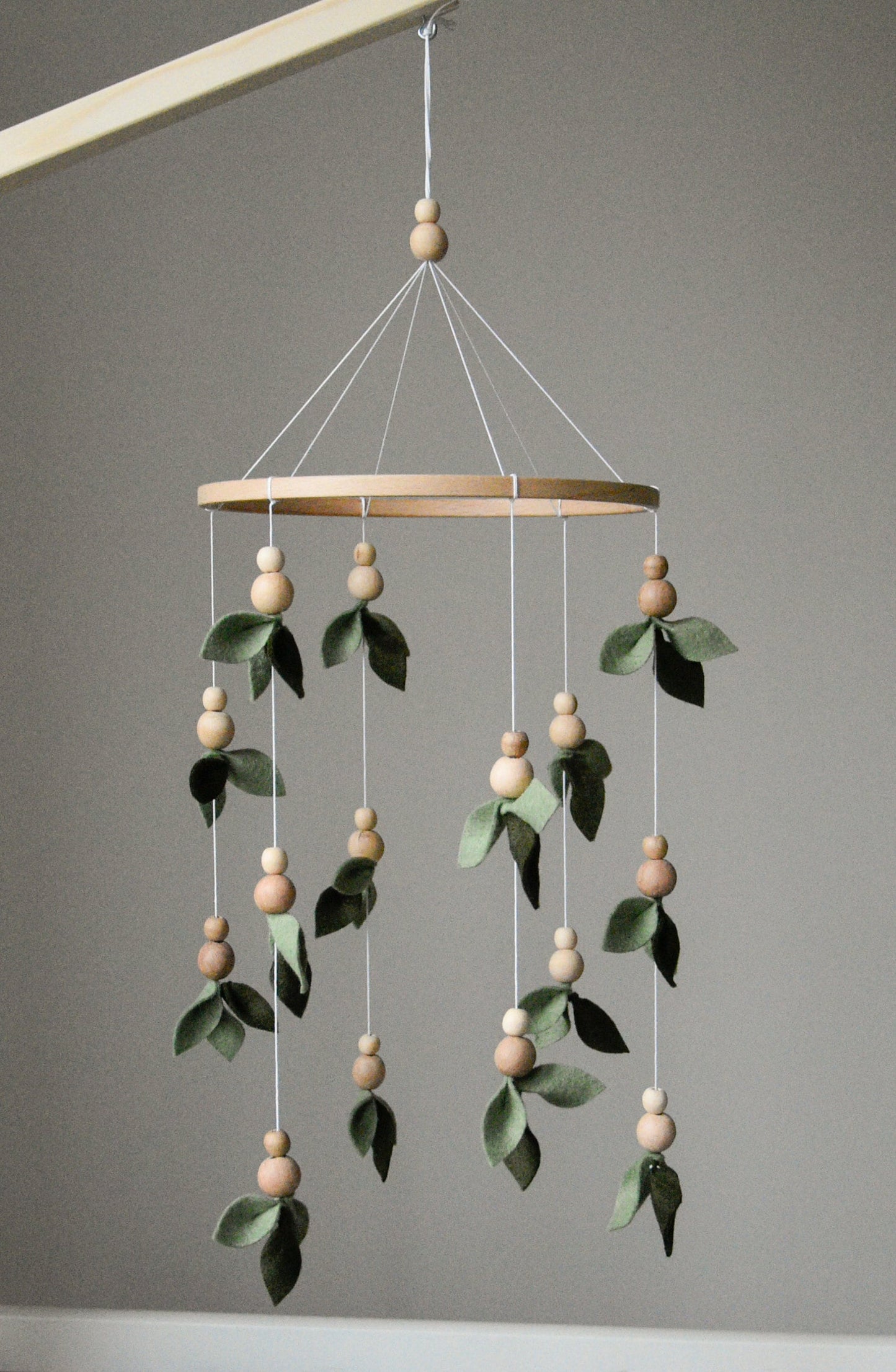 Forest style floral mobile with leaves and wooden pearls